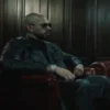 andrew tate sports coat couch