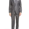 tom ellis in a grey suit
